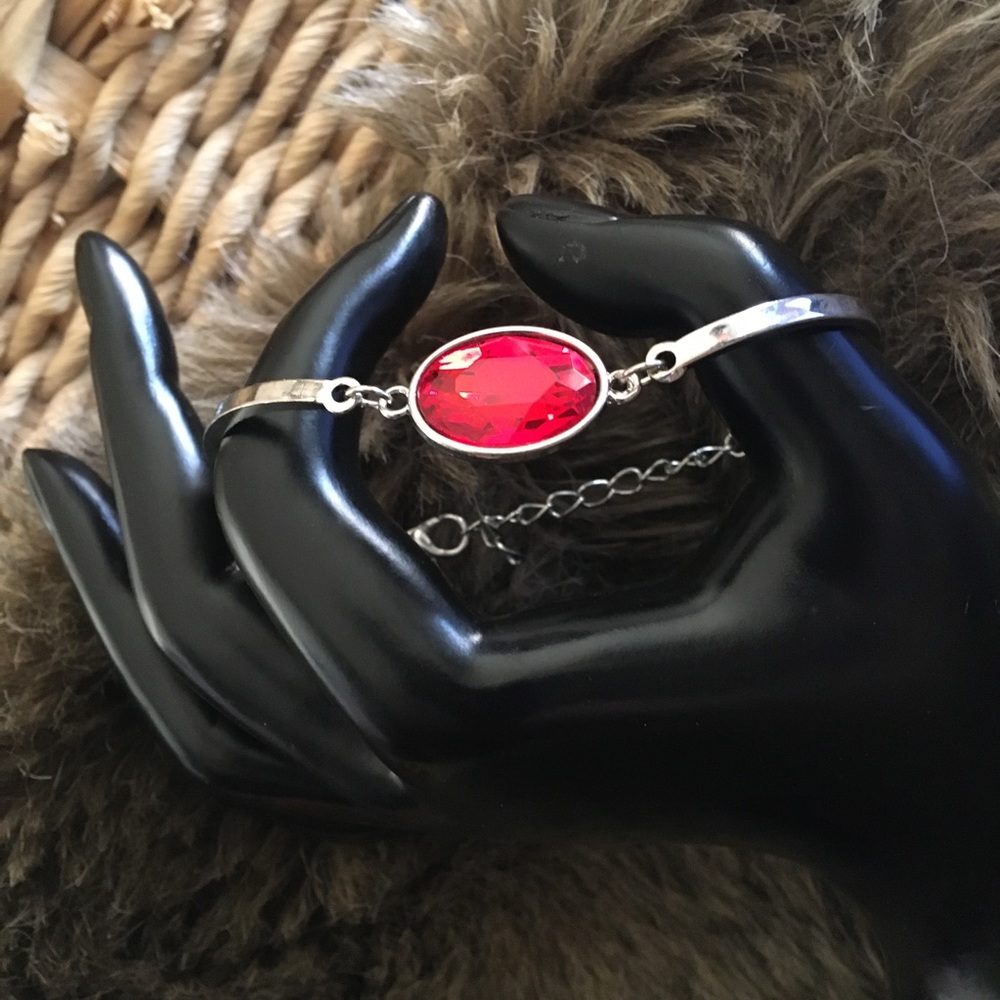 Silver tone faceted oval cut faux ruby bracelet